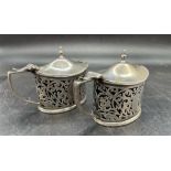 Two Elkington & Co Ltd silver mustards with blue glass liners, hallmarked for Birmingham 1900.