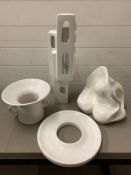 A selection of various decorative and sculptural white ceramics