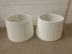 A pair of white lampshades