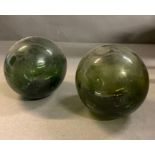 Two green spheres fishing floats