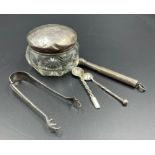 A selection of silver curios to include silver lidded jar, cheroot holder sugar nips etc.