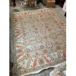 A rug 10' x 8' with floral pattern.