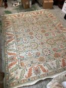 A rug 10' x 8' with floral pattern.