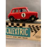 Four Scalextric motor racing cars C/26 Mini Cooper, C/65 Alfa Romeo1933, C/24 Austin Healey 3000,