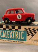 Four Scalextric motor racing cars C/26 Mini Cooper, C/65 Alfa Romeo1933, C/24 Austin Healey 3000,