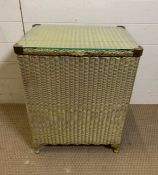 A Lloyds Loom storage bin with glass top and brass corner