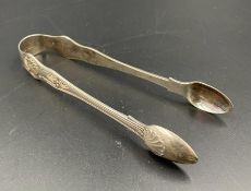 A pair of sugar tongs, hallmarked for London 1897.