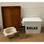 A bread bin tray and marble mortar