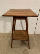 An oak square side table on tapering legs (H69cm Sq41cm)