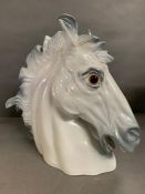A galloping china horse head sculpture (50cm x 51cm)
