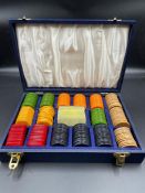 A cased vintage set of gaming chips or markers by Cheney