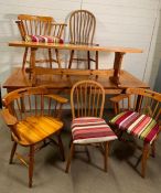 A pine farm house style table with three carvers and two bentwood chairs and a bench (H76cm W178cm