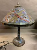 A Tiffany style table lamp with dragon fly design to shade and base