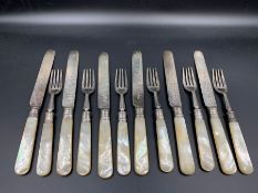 A set of six silver mother of pearl and silver knives and forks by Boardman & Glossop & Co Sheffield