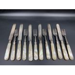 A set of six silver mother of pearl and silver knives and forks by Boardman & Glossop & Co Sheffield
