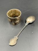 A silver spoon and a napkin ring