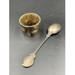 A silver spoon and a napkin ring