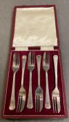 A boxed set of silver dessert forks, hallmarked Sheffield 1971, makers mark HH