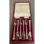 A boxed set of silver dessert forks, hallmarked Sheffield 1971, makers mark HH