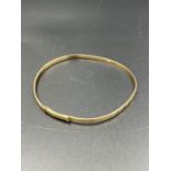 A 9ct gold Childs adjustable bangle (2.7g)