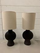 A pair of contemporary terracotta Sergio table lamps
