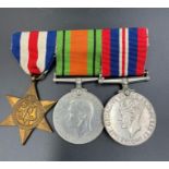 A WW2 Medal Trio of France and Germany Star, Defence Medal and War Medal 1939-1945