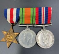 A WW2 Medal Trio of France and Germany Star, Defence Medal and War Medal 1939-1945