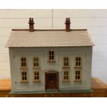 A vintage large wooden dolls house