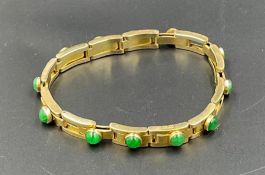 A Chinese 20ct gold and jade bracelet, (Total Weight 27g) by Hung Cheong.