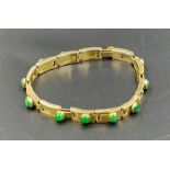 A Chinese 20ct gold and jade bracelet, (Total Weight 27g) by Hung Cheong.