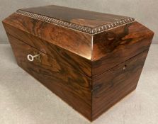 A Rosewood sarcophagus shape tea caddy, the interior with a pair of hinged lidded canisters AF