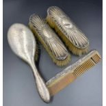 A selection of silver backed dressing table brushes
