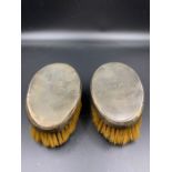 A Pair of silver backed brushes, hallmarked for London 1948 by William Comyns & Sins Limited