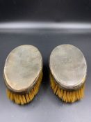 A Pair of silver backed brushes, hallmarked for London 1948 by William Comyns & Sins Limited