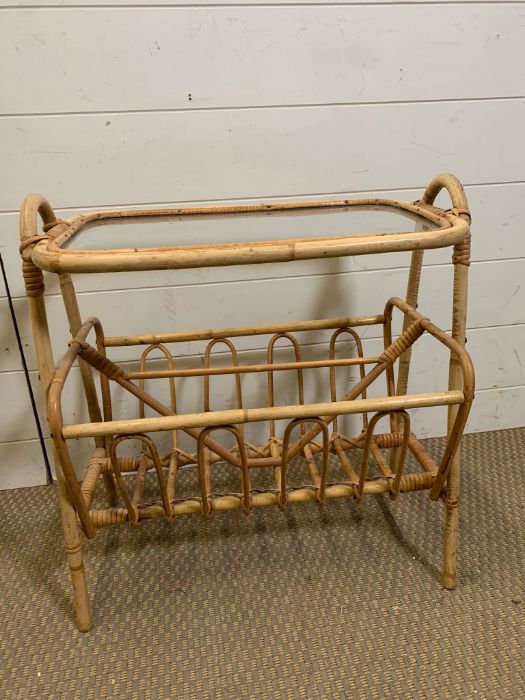 A magazine rack with a glass top