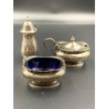 A Mappin & Webb silver three piece cruet set