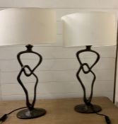A pair of sculptural lights possibly painted brown bronze by Tyson London