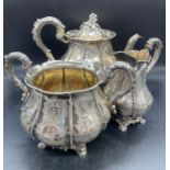 A substantial Victorian silver tea service with sugar bowl, milk jug and teapot by IW hallmarked for