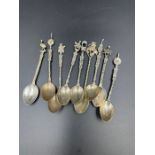 A selection of white metal collectable spoons