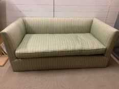 A two seater square back sofa