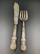 A pair of Victorian silver fish servers by FH, hallmarked for London 1847.