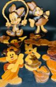 A selection of wall hanging wooden Disney characters