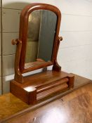 A dressing table mirror