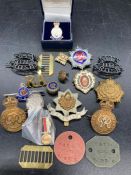 A selection of military badges, insignia etc.