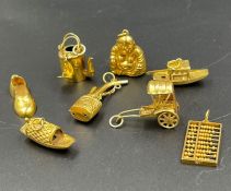 A selection of 14ct gold charms (Total weight 7.3g)