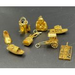 A selection of 14ct gold charms (Total weight 7.3g)