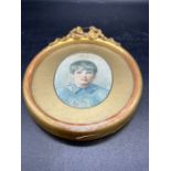 A miniature portrait of a young boy