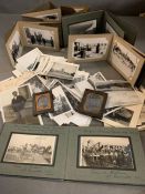 A selection of historical photographs including Graf Zeppelin, Belgium solider graves and touring