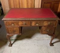 A George II style knee hole desk