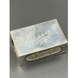 A silver matchbox cover, Birmingham hallmark for 1909 by Deakin & Francis Ltd